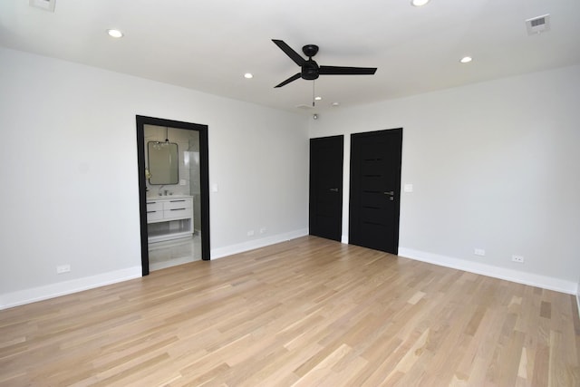 unfurnished bedroom with ceiling fan and light hardwood / wood-style flooring