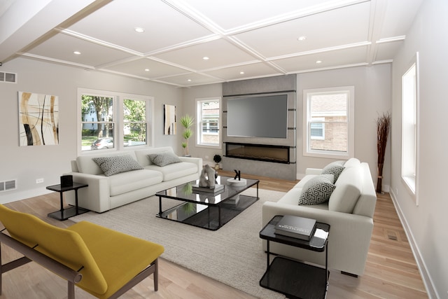 living room with a large fireplace, coffered ceiling, and light hardwood / wood-style flooring