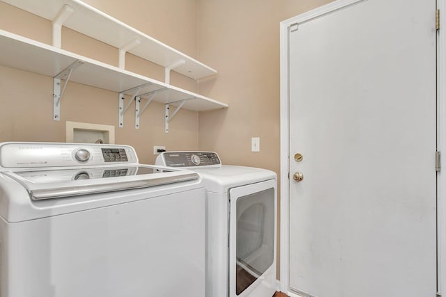 laundry room featuring washer and clothes dryer