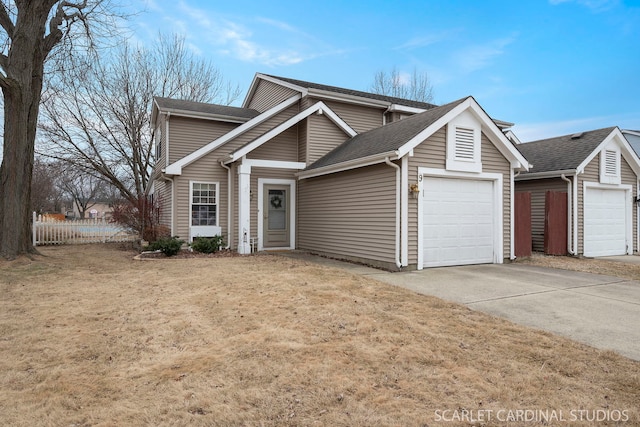 view of front property featuring a garage and a front yard