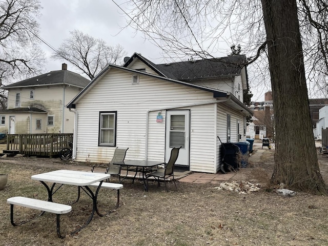 rear view of house with a deck