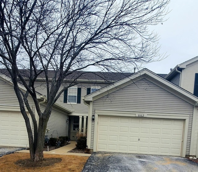 662 W Kristina Ln, Round Lake, IL 60073 - view of front of house featuring a garage