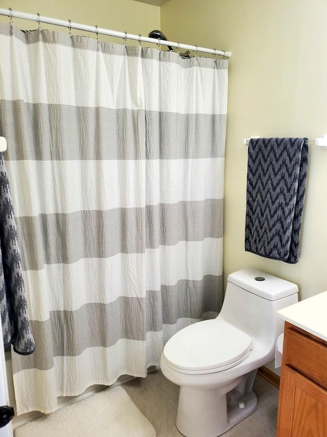 662 W Kristina Ln, Round Lake, IL 60073 - bathroom featuring tile patterned flooring, vanity, curtained shower, and toilet