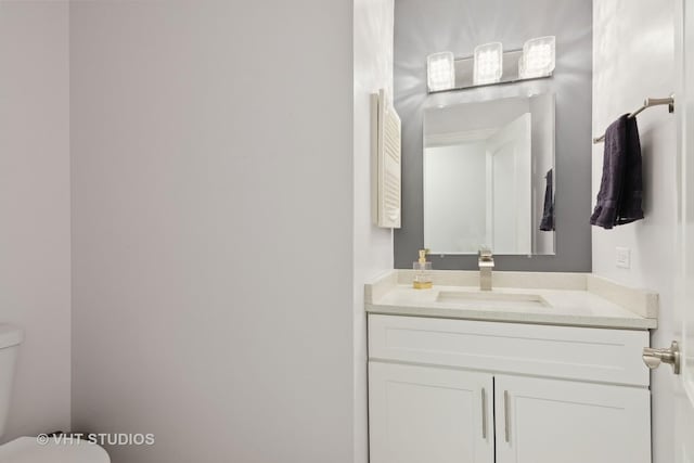 bathroom with vanity and toilet