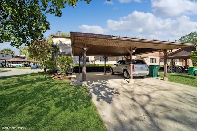 view of vehicle parking with a yard and a carport