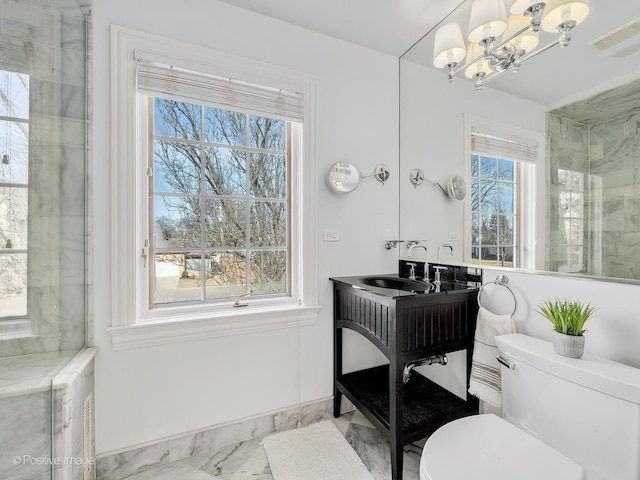 full bathroom with toilet, a sink, visible vents, baseboards, and marble finish floor