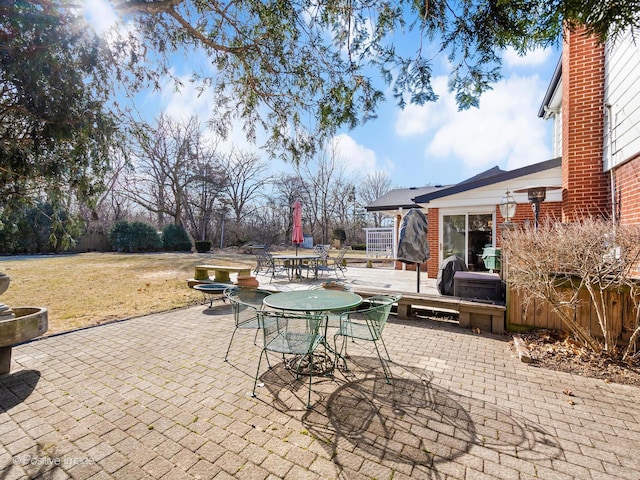 view of patio featuring outdoor dining area