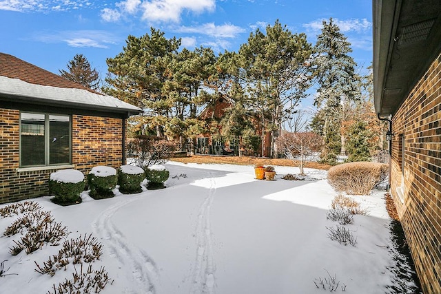 view of yard covered in snow