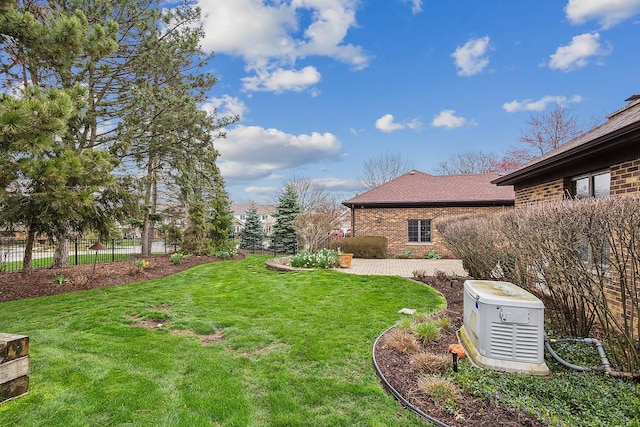 view of yard with fence and a patio