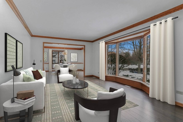 living room with hardwood / wood-style floors, crown molding, and plenty of natural light