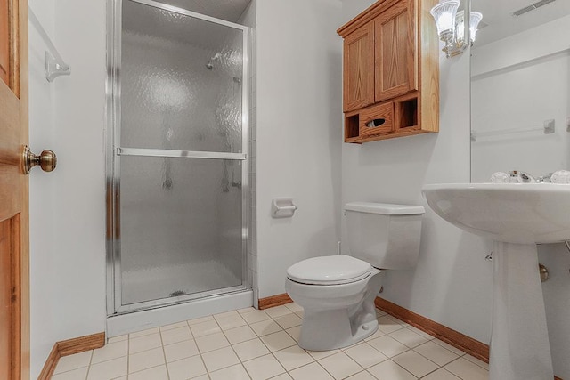 bathroom with walk in shower, tile patterned floors, and toilet