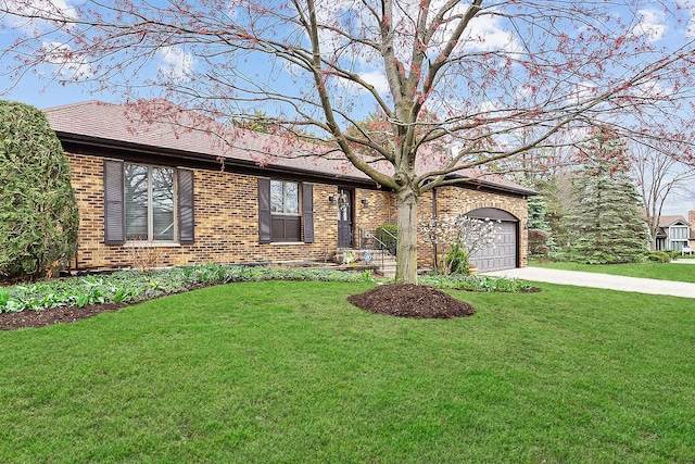 view of front facade featuring brick siding and an attached garage