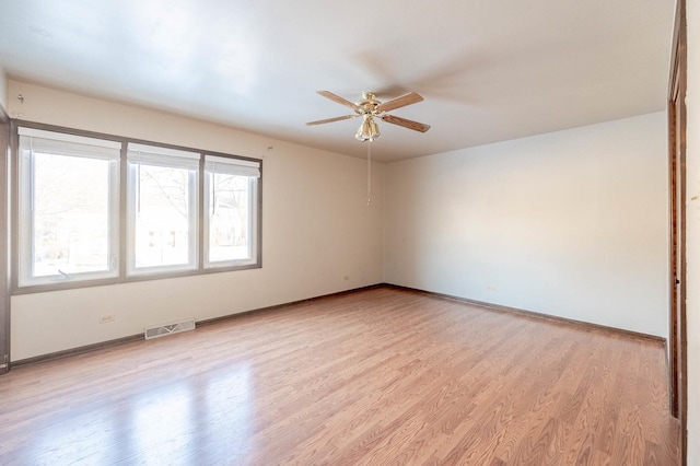 unfurnished room with light hardwood / wood-style floors and ceiling fan