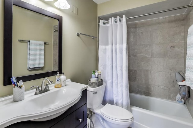 full bathroom with shower / bath combo, vanity, and toilet