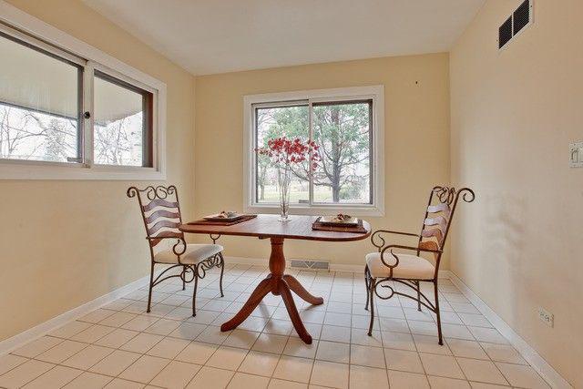 dining room featuring light tile patterned floors and breakfast area