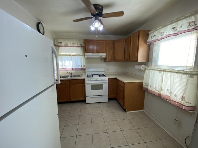 kitchen with ceiling fan, sink, light tile patterned floors, and white appliances