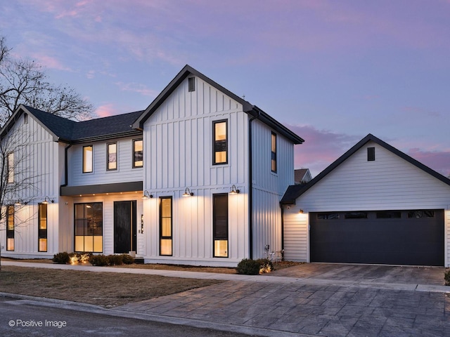 modern farmhouse style home featuring a garage