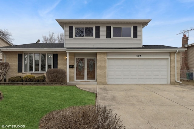 front facade with a garage and a front yard