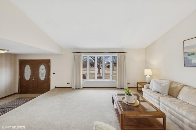 carpeted living room with lofted ceiling