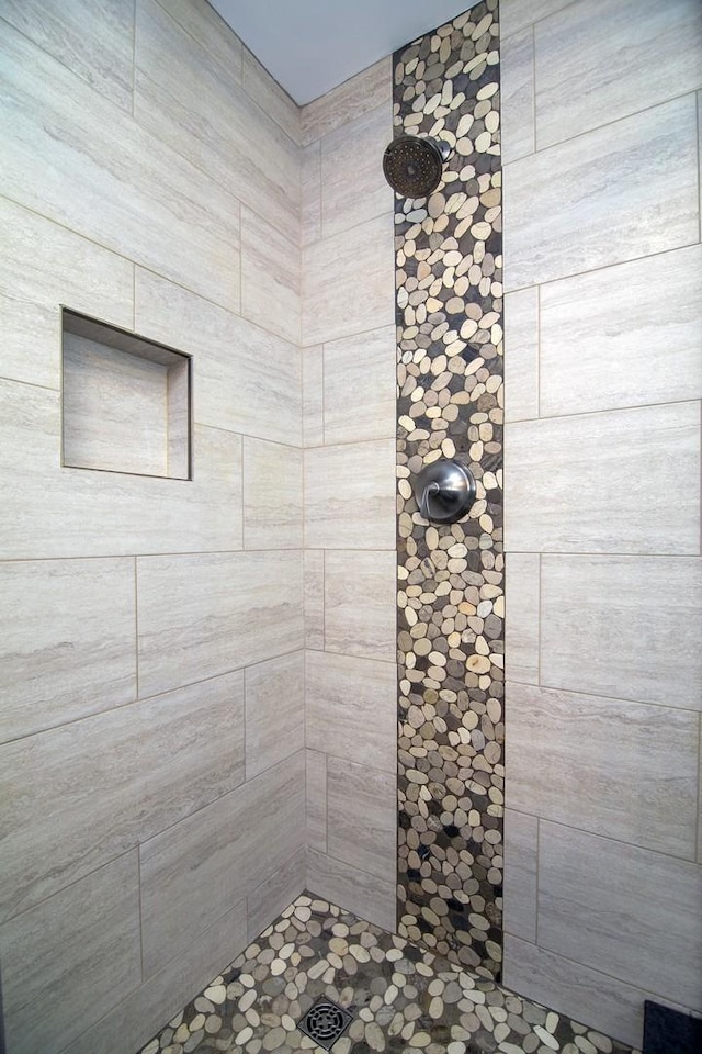 bathroom with tiled shower