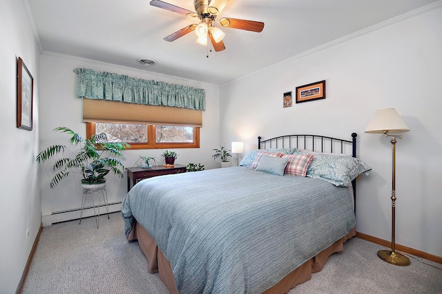 carpeted bedroom featuring ornamental molding, a baseboard heating unit, and ceiling fan