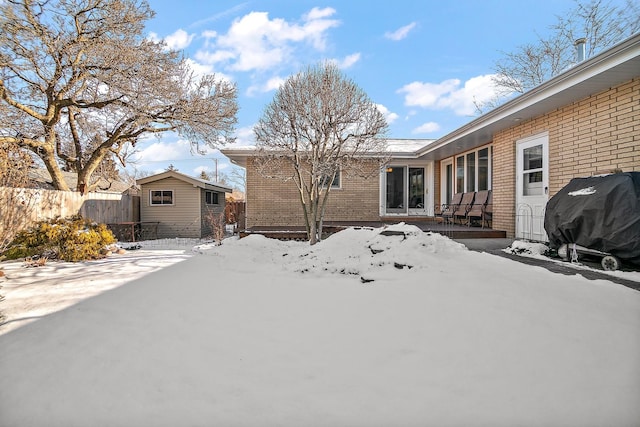 exterior space featuring a shed