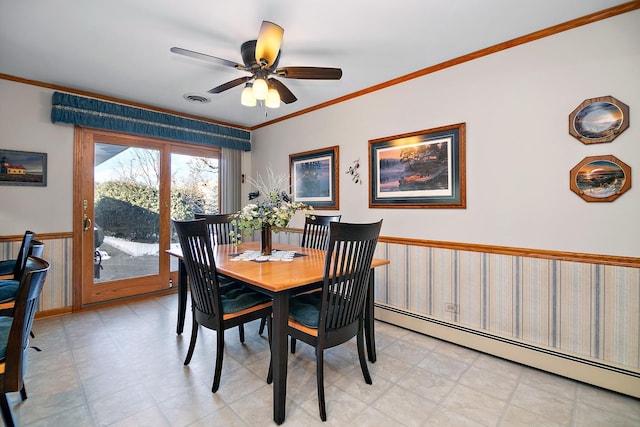 dining space with crown molding, ceiling fan, and baseboard heating