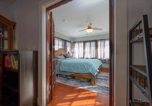 bedroom featuring ceiling fan and wood finished floors