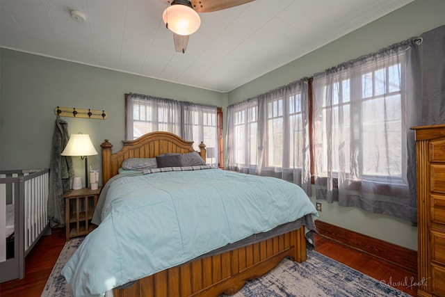 469 Dewey Ave, Galena, IL 61036 - bedroom featuring a ceiling fan, baseboards, and wood finished floors