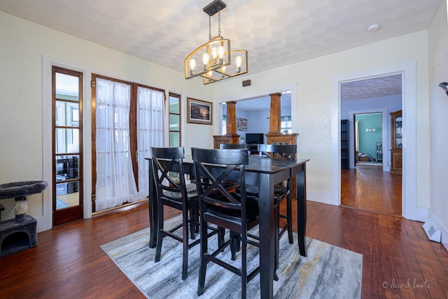 469 Dewey Ave, Galena, IL 61036 - dining space with a chandelier, hardwood / wood-style floors, and baseboards