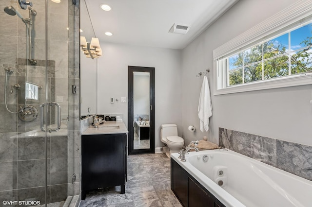 bathroom featuring visible vents, toilet, a stall shower, vanity, and a jetted tub