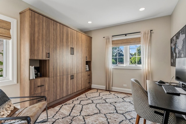 home office with light wood finished floors, baseboards, and recessed lighting