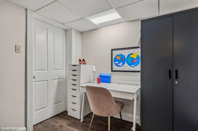 office space featuring a drop ceiling and dark wood finished floors