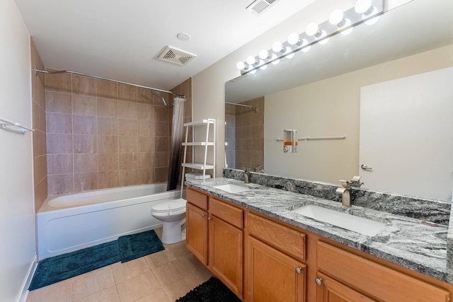 full bathroom with shower / tub combo with curtain, vanity, tile patterned flooring, and toilet