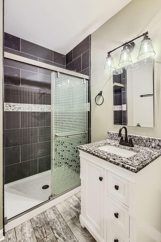 bathroom featuring vanity and walk in shower