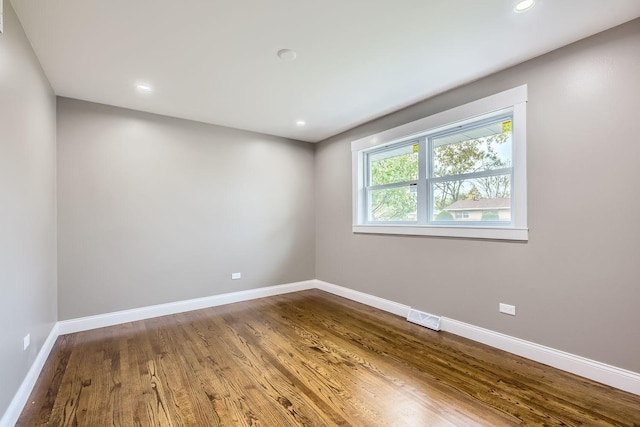 empty room featuring hardwood / wood-style flooring