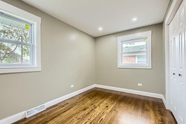 empty room featuring hardwood / wood-style floors