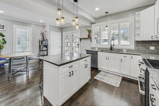 kitchen featuring dishwasher, dark countertops, stainless steel stove, open shelves, and a sink