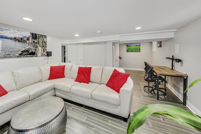 living room with light wood finished floors, baseboards, and recessed lighting