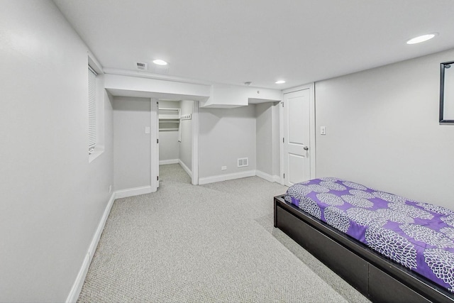 bedroom with baseboards, recessed lighting, visible vents, and light colored carpet