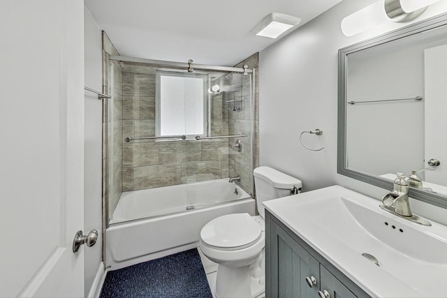 bathroom featuring enclosed tub / shower combo, vanity, and toilet