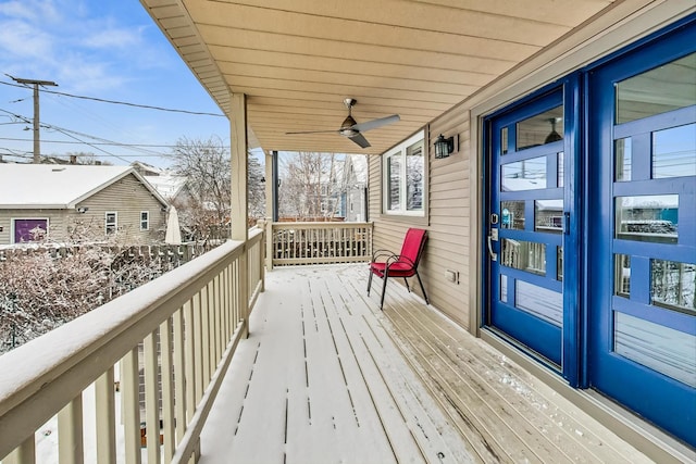 wooden deck with a porch and a ceiling fan