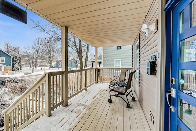 view of snow covered deck