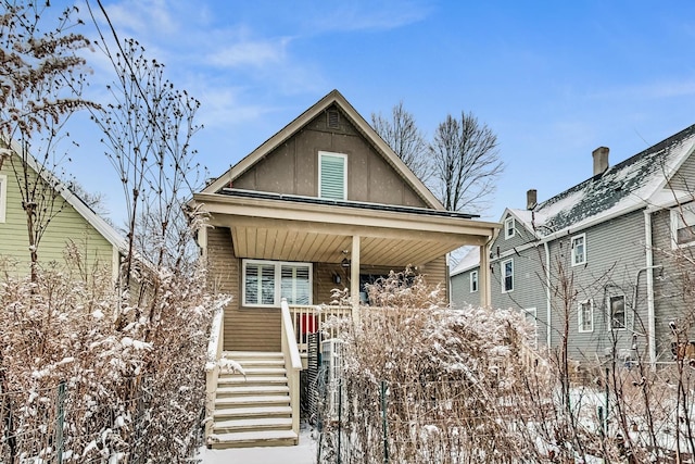 view of front of house featuring stairs and a porch