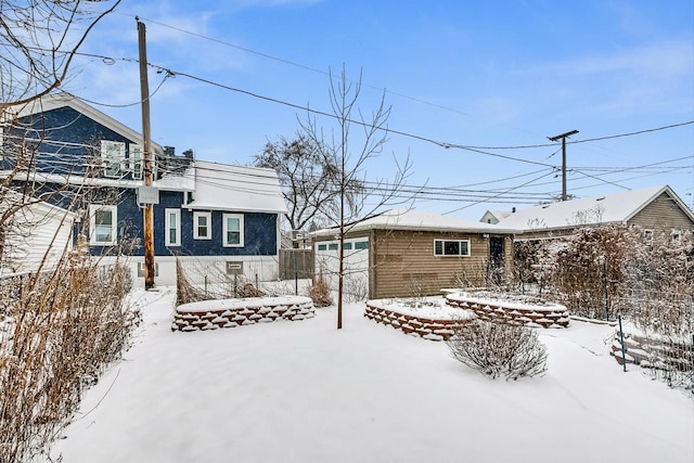 view of snow covered house