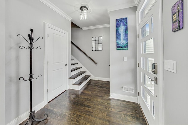 entrance foyer featuring dark wood-style flooring, visible vents, stairway, ornamental molding, and baseboards