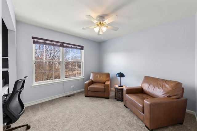 carpeted office with ceiling fan, visible vents, and baseboards