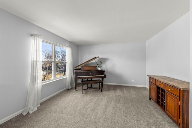 sitting room with carpet flooring and baseboards