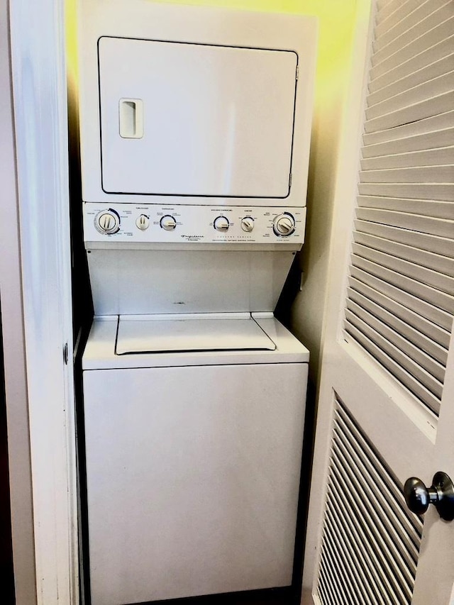 laundry area with laundry area and stacked washing maching and dryer