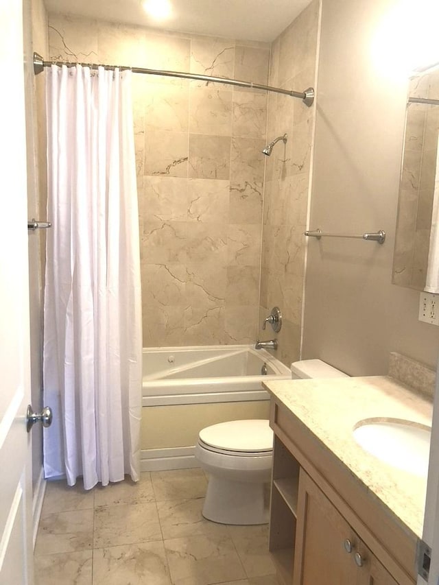 full bathroom featuring marble finish floor, vanity, toilet, and shower / tub combo with curtain